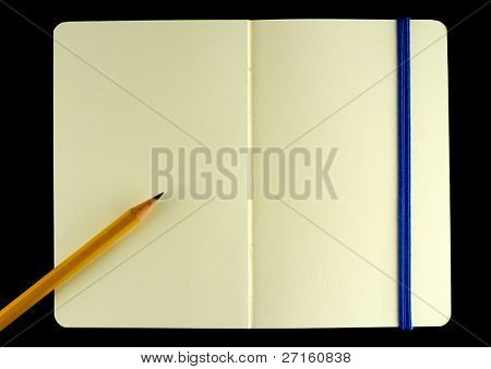 Classic opened moleskine note book with pencil isolated on black background