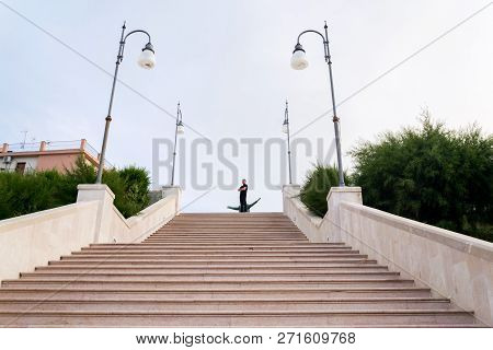 Polignano A Mare, Italy - July 6 2018: Tourist On Stairs Leading To Dramatic Cliffs Over Adriatic Se