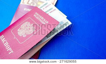 Passports On The Blue Background. Citizenship Of Estonia And Russia. Citizenship Of European Union (