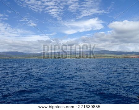 Beautiful Pakala Village Coast With Clouds Covering The Tops Of Mountains As Seen From Boat Off Shor