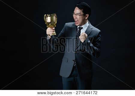 Asian Man In Formal Suit Holding And Rise Golden Trophy Cup, Reward Of Target Achievement Winner, Pr