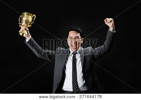 Asian Man In Formal Suit Holding And Rise Golden Trophy Cup, Reward Of Target Achievement Winner, Pr