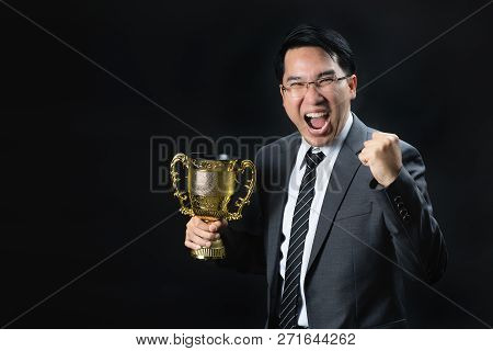 Asian Man In Formal Suit Holding And Rise Golden Trophy Cup, Reward Of Target Achievement Winner, Pr