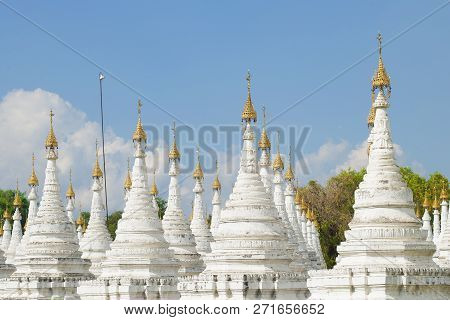 White Stupas Sandarmuni Pagoda On A Sunny Day. Mandalay, Burma