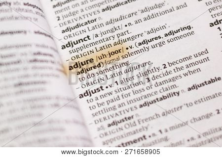 The Word Or Phrase Adjure In A Dictionary Highlighted With Marker.