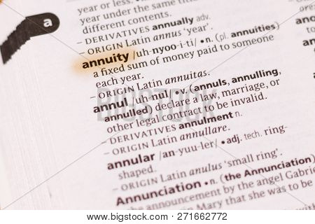 The Word Or Phrase Annuity In A Dictionary Highlighted With Marker.