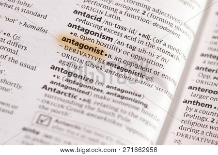 The Word Or Phrase Antagonist In A Dictionary Highlighted With Marker.