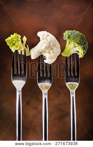 Forks With Pieces Of Some Types Of Cabbage In The Foreground