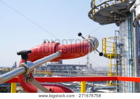 Fireplug To Put Out A Fire Against The Background Of An Installation At An Oil Refinery