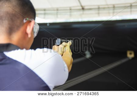 Bangkok Thailand, Nov 24, 2018:- Man Hold A Gun Ready To Shoot  Practicing Shooting At Shooting Rang