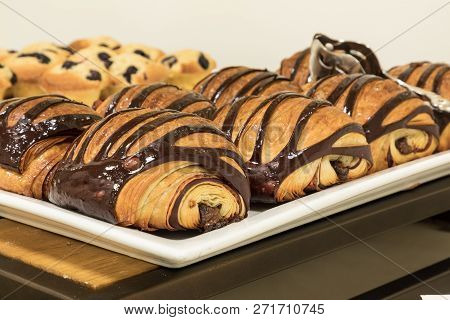 Flakey Chocolate Croissant Grouped On A Plate In A Bakery Fresh From The Oven With Homemade Chocolat