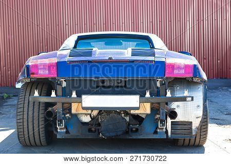 Blue Italian Supercar Cabriolet. Damage To The Rear And Front Bumper After An Accident. Service And 
