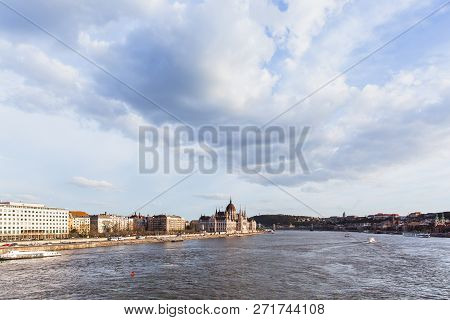 View Of The Hungarian Parliament From Margared Bridge In Budapest At Sunset