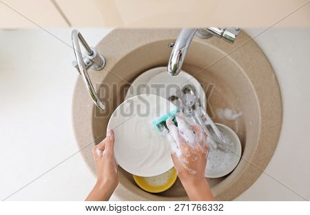 Woman Washing Dirty Dishes In Kitchen Sink, Top View. Cleaning Chores