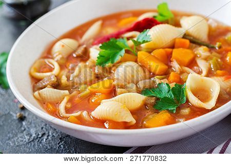 Minestrone, Italian Vegetable Soup With Pasta On  Table. Vegan Food