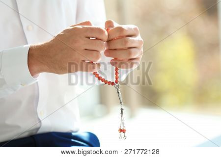 Muslim Man With Misbaha Praying Indoors, Closeup