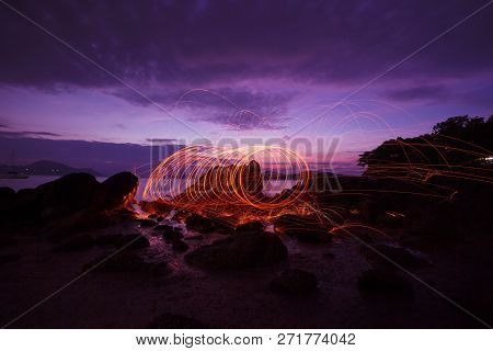 Swing Fire Swirl Steel Wool Light Photography Over The Stone With Reflex In The Water Beautiful Ligh