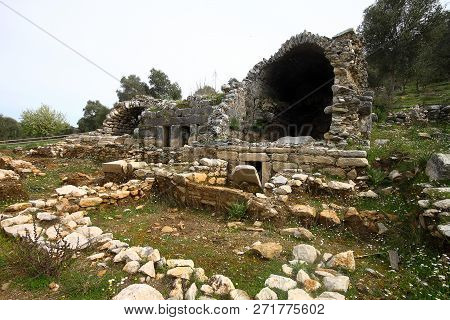 Ruined Walls Of Castle Over The Lake Bafa In A Nature Reserve Situated In Southwestern Turkey