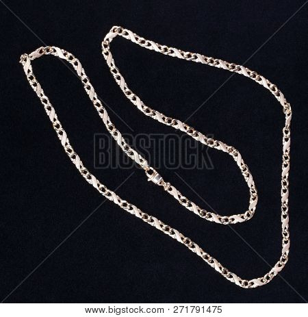 Image Of Many Yellow Gold Chain On Black Fabric