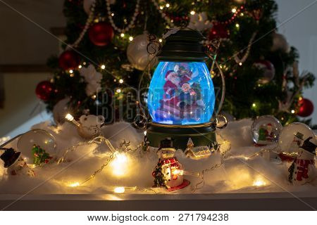 Christmas Decoration, Snow Dome, Globe With Table Decoration, Santaclaus On Sleigh With Child In Win