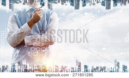 Double Exposure Of Confident And Young Businessman In Smart-casual Wear Smoking Pipe And Modern City