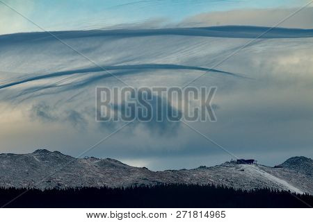 Wind Game Over Clouds Over Mountain Chopok. Cloudy Clouds Create Beautiful Color And Shape Creations