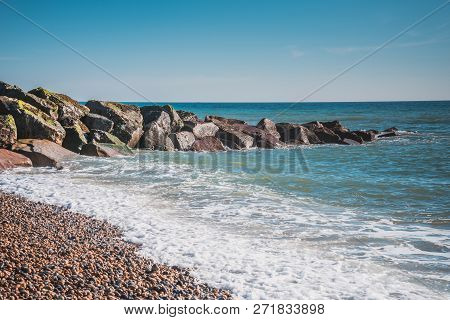 Saltdean Beach Seafront Undercliff With Beautiful Blue Water And Rock Breakwater Beach In Background