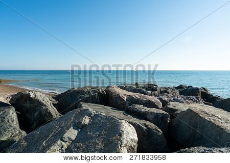 Saltdean Beach Seafront Cliffs With Boats In The Background At East Sussex Brighton Marina, Uk.