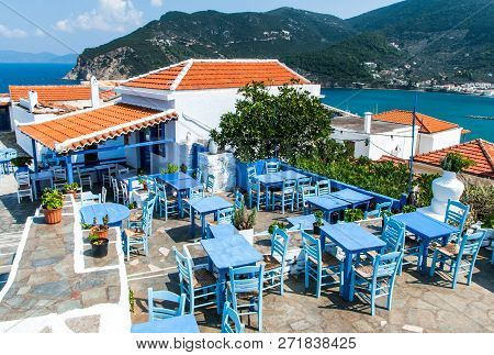 An Old Restaurant On Hill In Skopelos Town With Outdoor Seats From Woodware Blue Painted Furnitures 