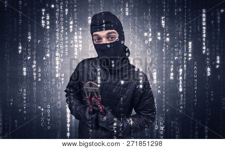 Burglar in action with encoded concept and his tools in his hand. 