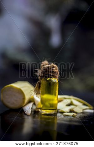 Close Up Of Essential Oil Of Bottle Gourd Or Dudhi Or  Calabash In A Transparent Glass Botlle On Woo