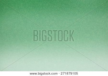 Green Colored Construction Paper. Close up view of Colored Construction Paper. Backgrounds and Textures. Opacity filter used to lighten and grade the image.
