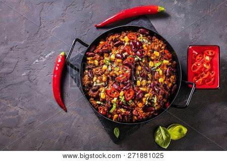 Chili Con Carne In A Clay Bowl On A Concrete Or Stone Rustic Background- Traditional Dish Of Mexican
