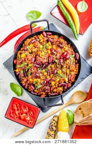 Chili Con Carne In A Clay Bowl On A Concrete Or Stone Rustic Background- Traditional Dish Of Mexican