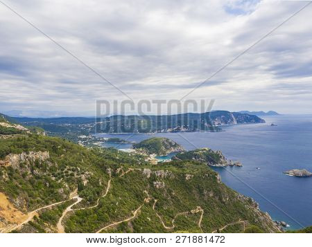 View At Zigzag Road, Hills Cllifs, Forest And Turquoise Blue Sea At Paleokastritsa Bay From The View