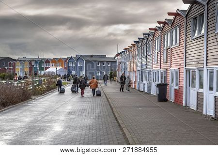 Helgoland, Germany - December 18, 2016: People And Shops In The Harbor Of Helgoland Island On A Clou