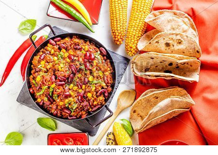 Chili Con Carne In A Clay Bowl On A Concrete Or Stone Rustic Background- Traditional Dish Of Mexican