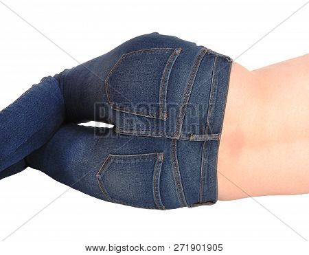 The Bottom Of A Young Woman Wearing Jeans In Close-up, Body Parts
Lying On The Floor From The Back, 