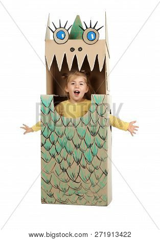 Little Girl In Cardboard Costume Of Dinosaur On White Background