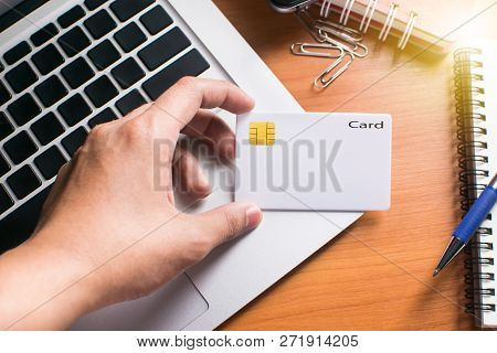 Businessman Checking The Transfer Payment With Holding A Credit Card