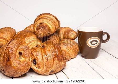 An Buttercake With Raisins And Croissant Is Made Of Puff Pastry