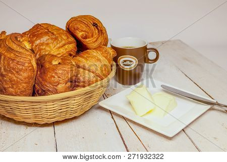 An Buttercake With Raisins And Croissant Is Made Of Puff Pastry
