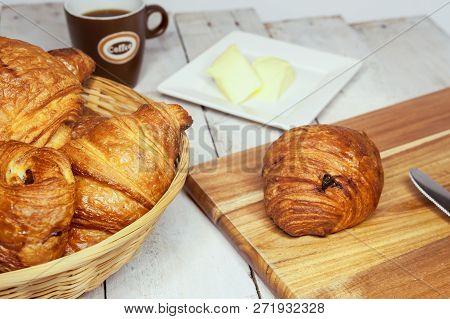 An Buttercake With Raisins And Croissant Is Made Of Puff Pastry