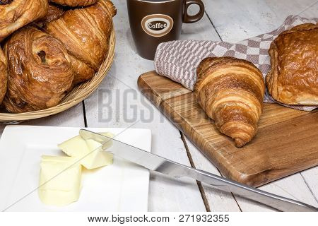 An Buttercake With Raisins And Croissant Is Made Of Puff Pastry