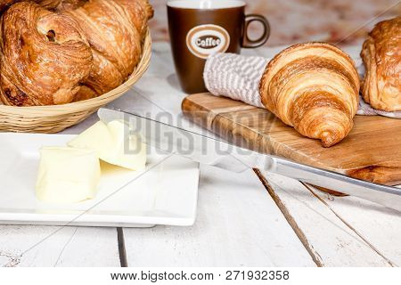 An Buttercake With Raisins And Croissant Is Made Of Puff Pastry