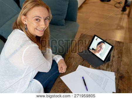 Beautiful Freelance Woman Consultant Having A Video Conference Call With Online Client At Home