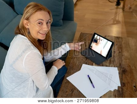 Beautiful Freelance Woman Consultant Having A Video Conference Call With Online Client At Home