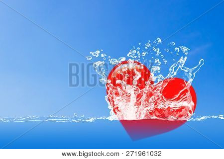 Love And Valentine Day Concept, Red Heart Faiing In The Water