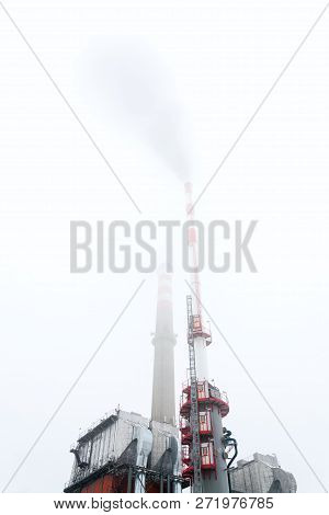 Old A New Chimneys At Heating Plant Covered In Fog, Cloudy Winter Day, Low Angle View, Energy Produc