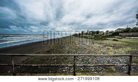 Rusty Bridge Stretching Into The Lifeless Sea, Caspian Sea Under Blue Sky In Early September, Snag O